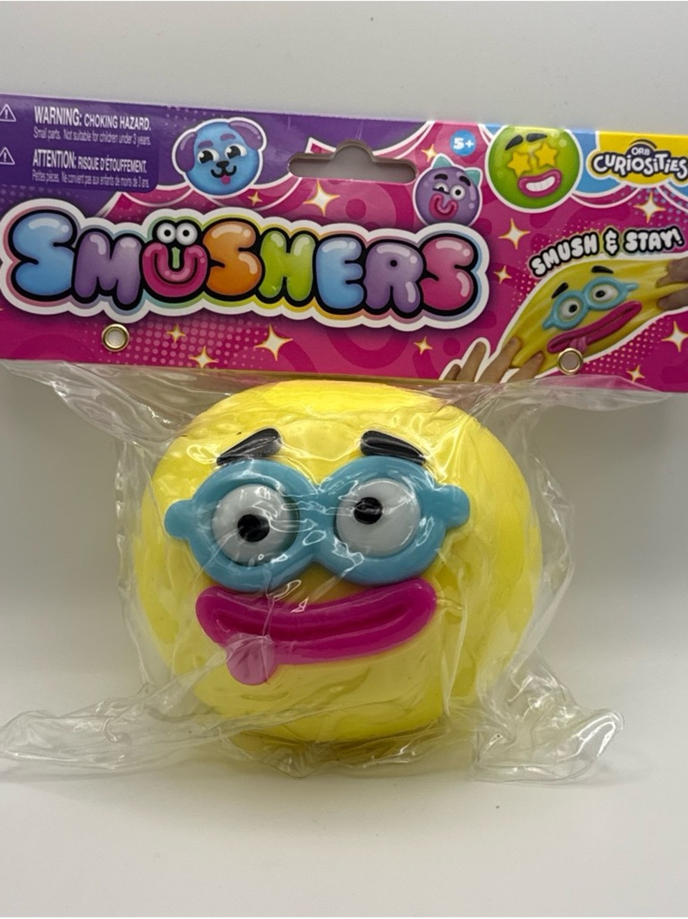 ORB Yellow Emoji Smushers Squishy with Blue and Pink Tongue